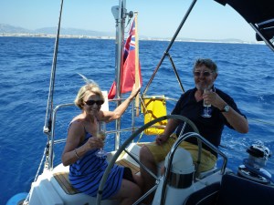Hoisting the Red Ensign.