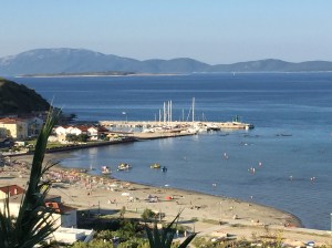 One of the few sandy beaches in Croatia, Susak. Exotica is the highest mast.